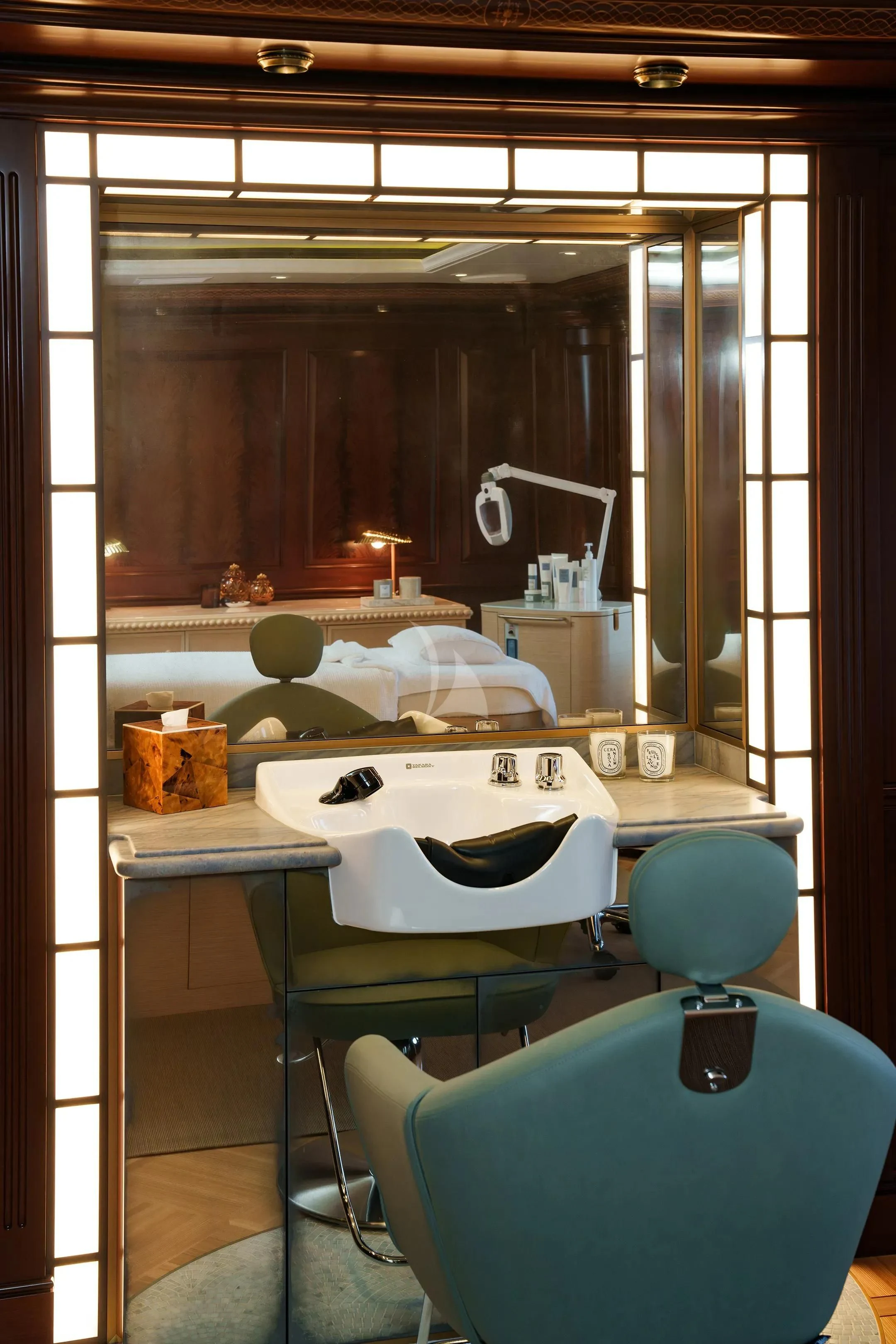 a bathroom with a sink and a mirror aboard FIREBIRD Yacht for Charter