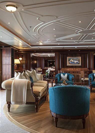 a room with chairs and a table aboard FIREBIRD Yacht for Charter