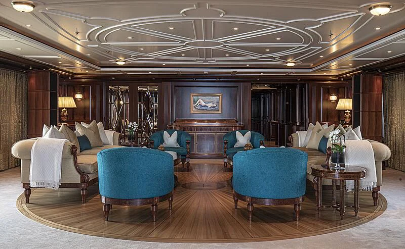 a large living room with a large chandelier aboard FIREBIRD Yacht for Charter