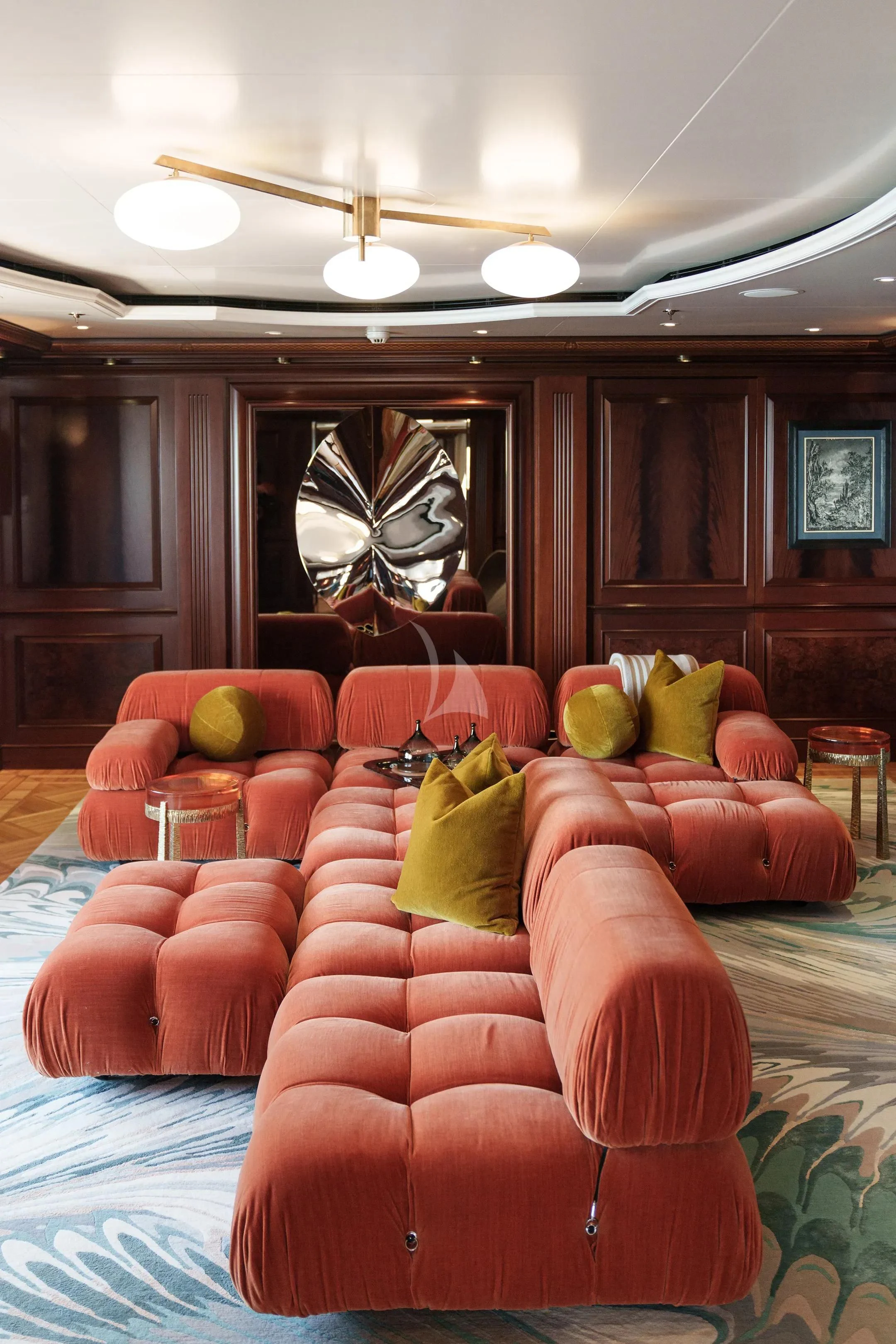 a living room with a large mirror aboard FIREBIRD Yacht for Charter