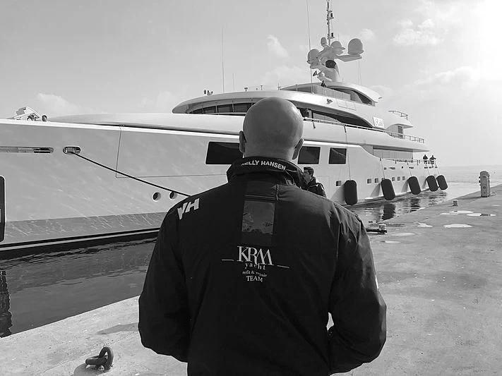 a man standing in front of a plane aboard RAHIL Yacht for Sale