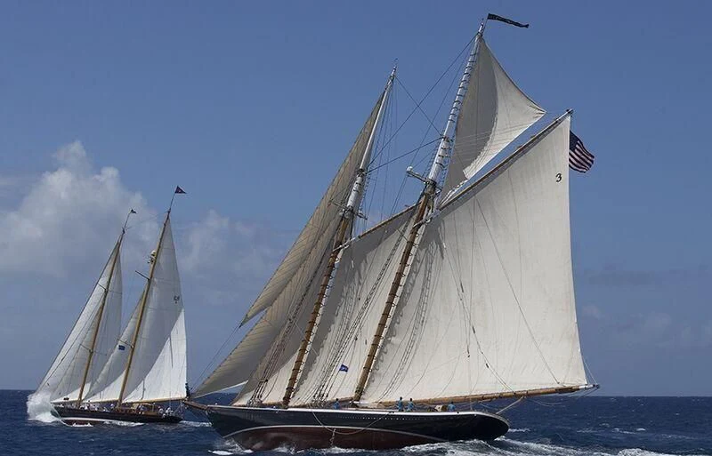 a couple of sailboats on the water aboard ASCHANTI IV OF VEGESACK Yacht for Sale