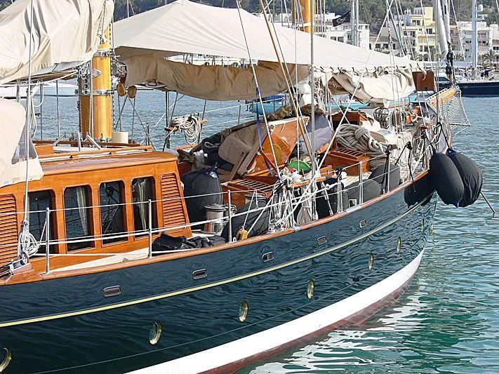 a boat with a large sail aboard ASCHANTI IV OF VEGESACK Yacht for Sale