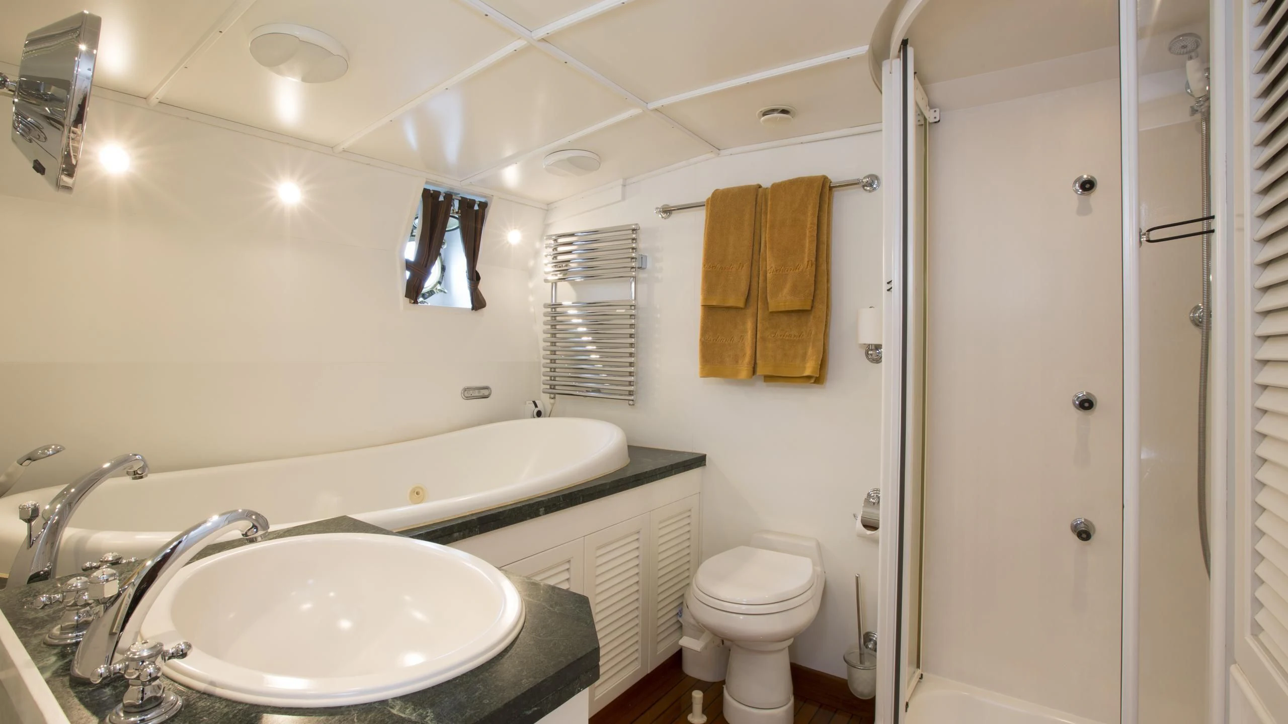 a bathroom with a sink toilet and shower aboard ASCHANTI IV OF VEGESACK Yacht for Sale