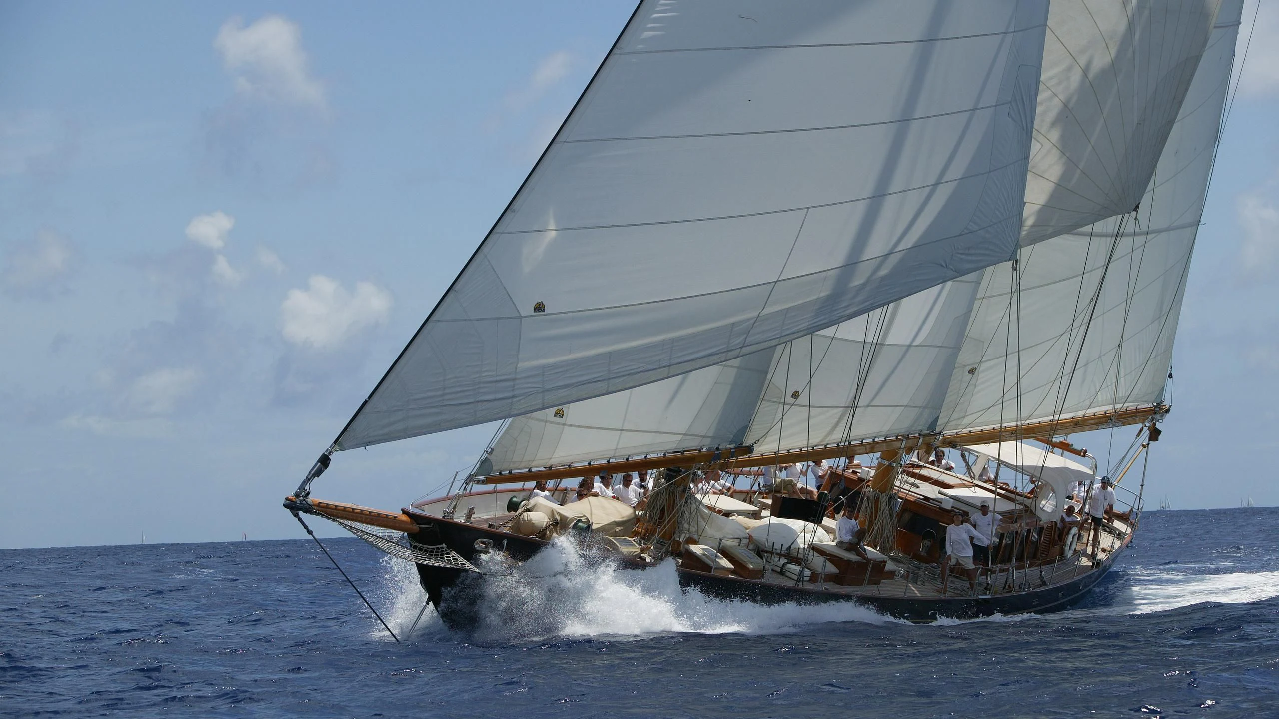 a sailboat with people on it aboard ASCHANTI IV OF VEGESACK Yacht for Sale