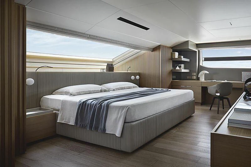 a bedroom with a large bed aboard EROS Yacht for Sale
