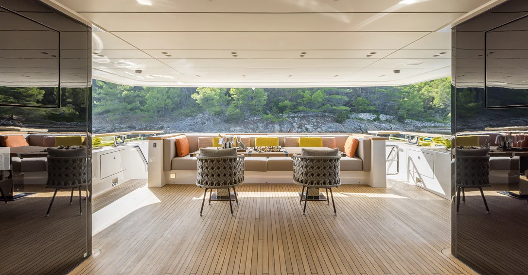 a room with a couch and chairs aboard EROS Yacht for Sale