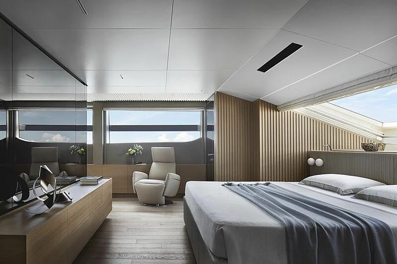 a room with a bed and a desk aboard EROS Yacht for Sale