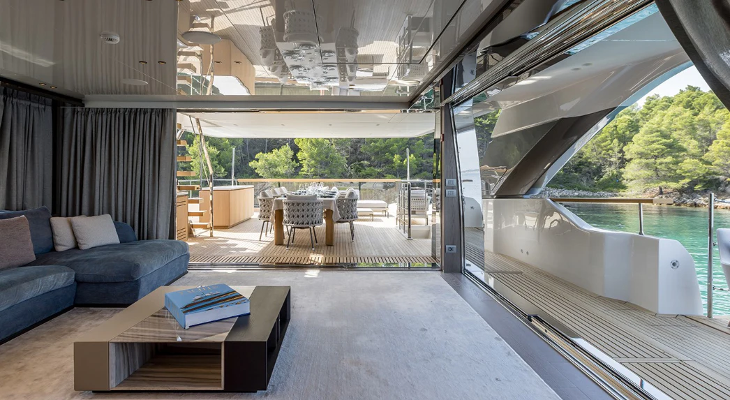 a living room with a large patio aboard EROS Yacht for Sale