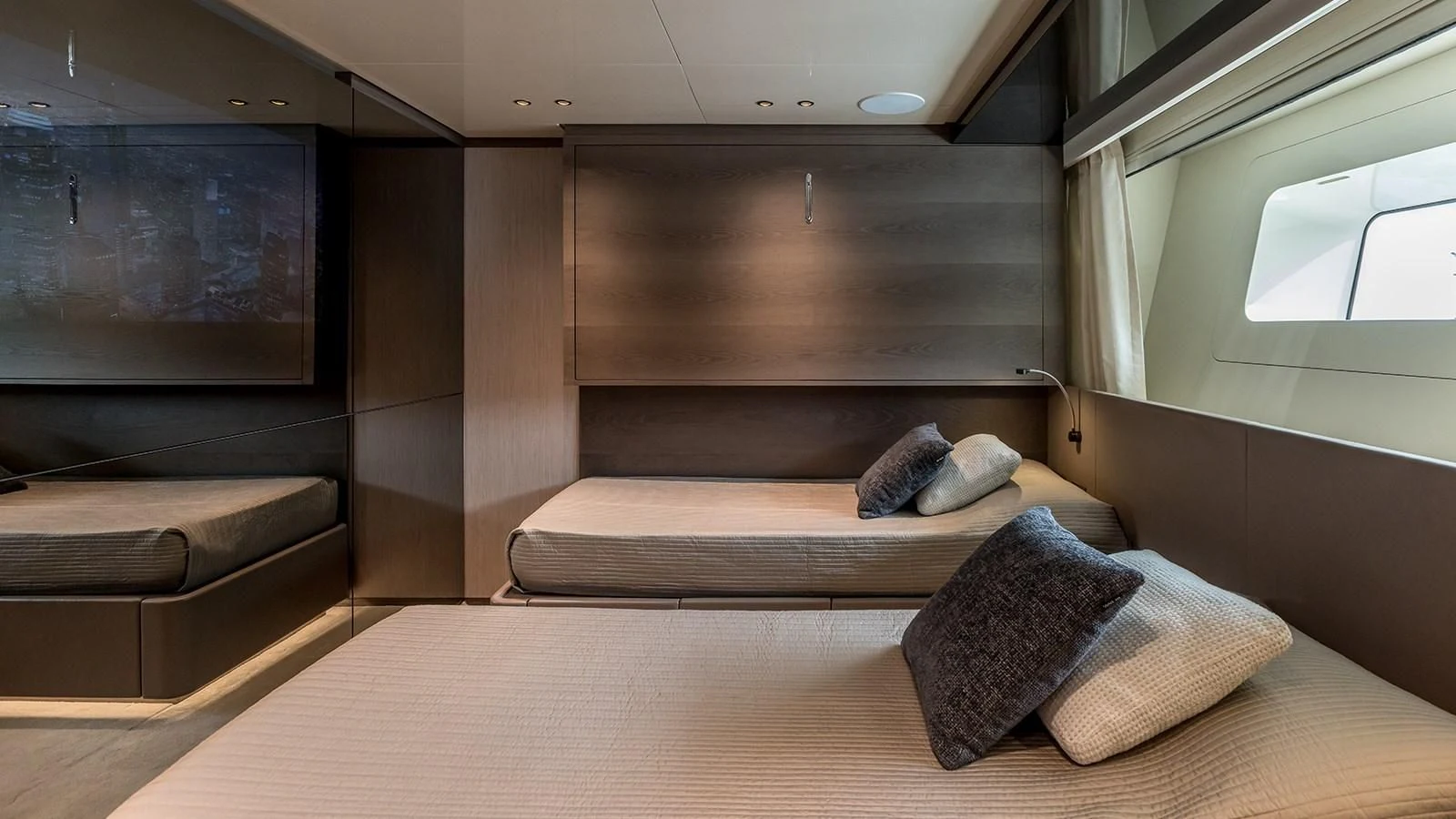 a room with a bed and a tv aboard EROS Yacht for Sale