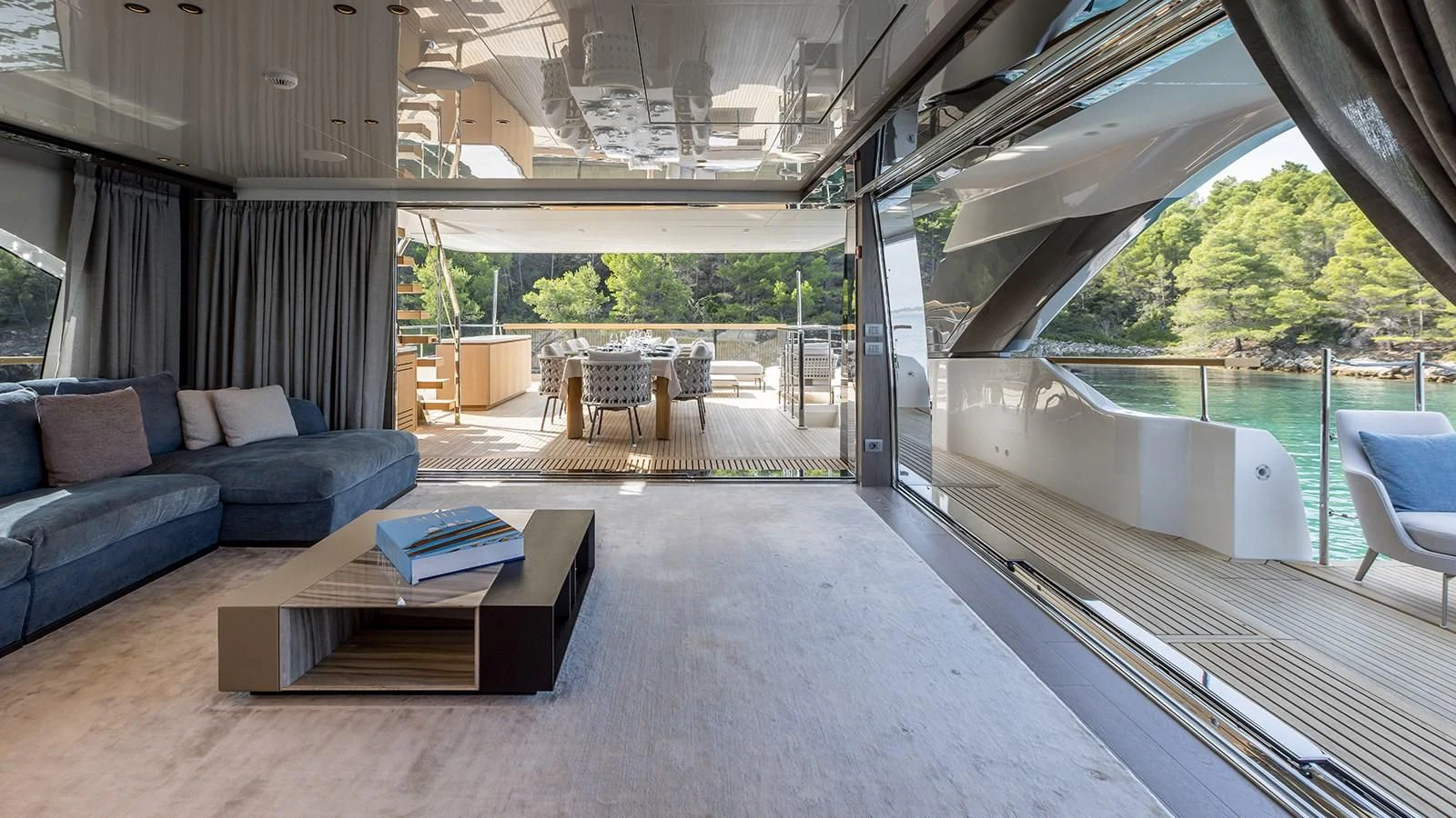 a large living room with a large patio and a pool aboard EROS Yacht for Sale