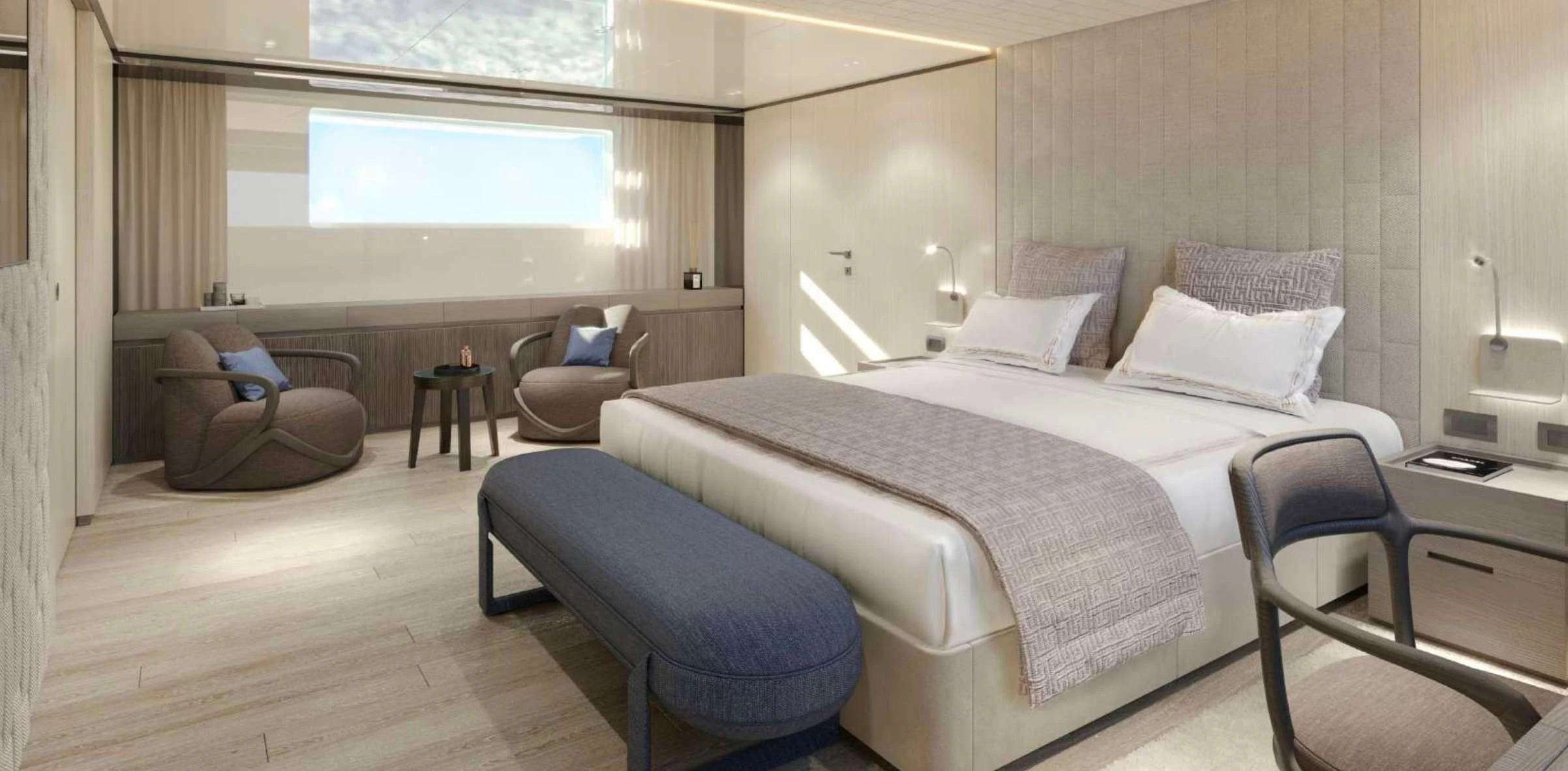 a room with a bed and a chair aboard EROS Yacht for Sale