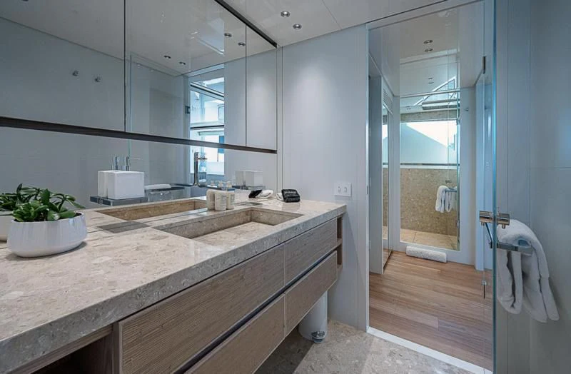 a bathroom with a countertop sink and a mirror aboard EROS Yacht for Sale