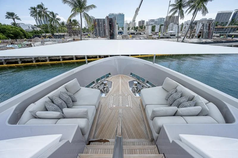 a deck with chairs and a pool aboard EROS Yacht for Sale
