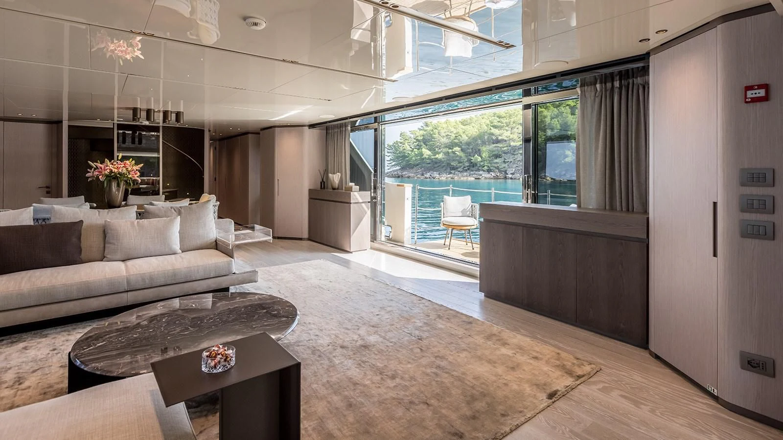 a living room with a large window aboard EROS Yacht for Sale