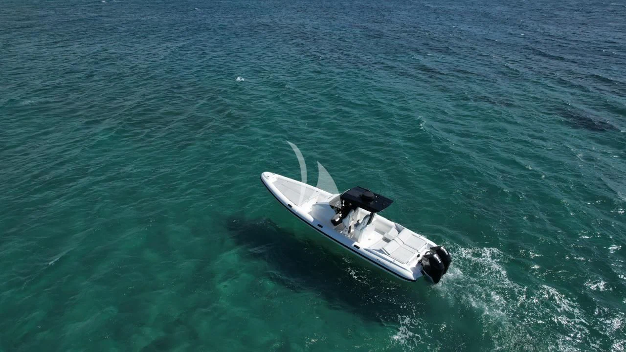 a small boat in the water aboard EROS Yacht for Sale
