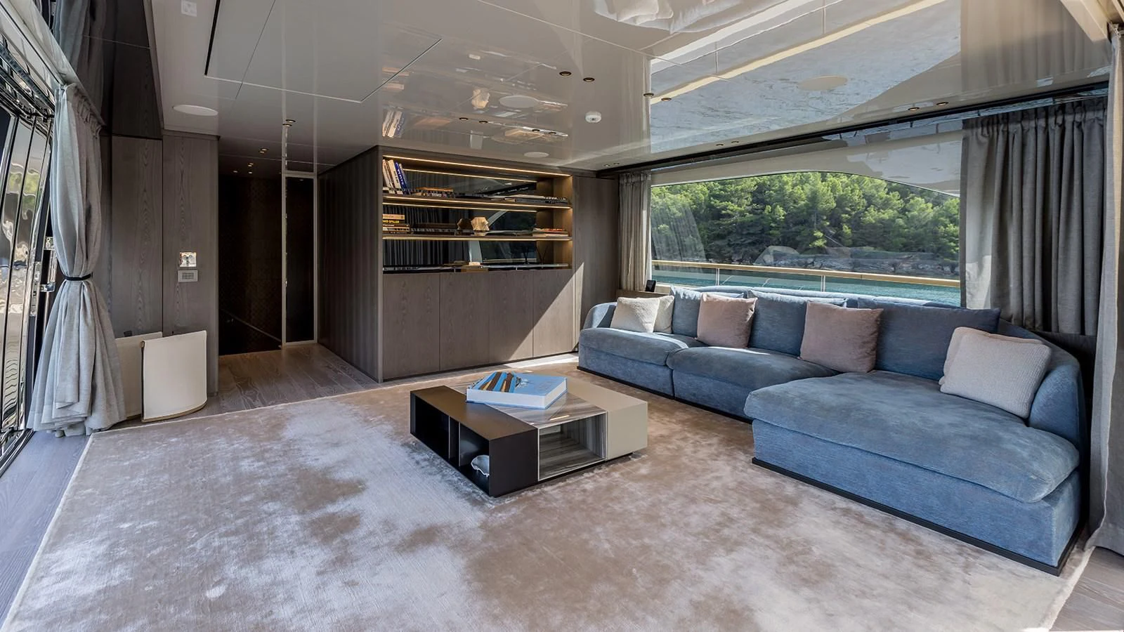 a living room with a couch and a table aboard EROS Yacht for Sale