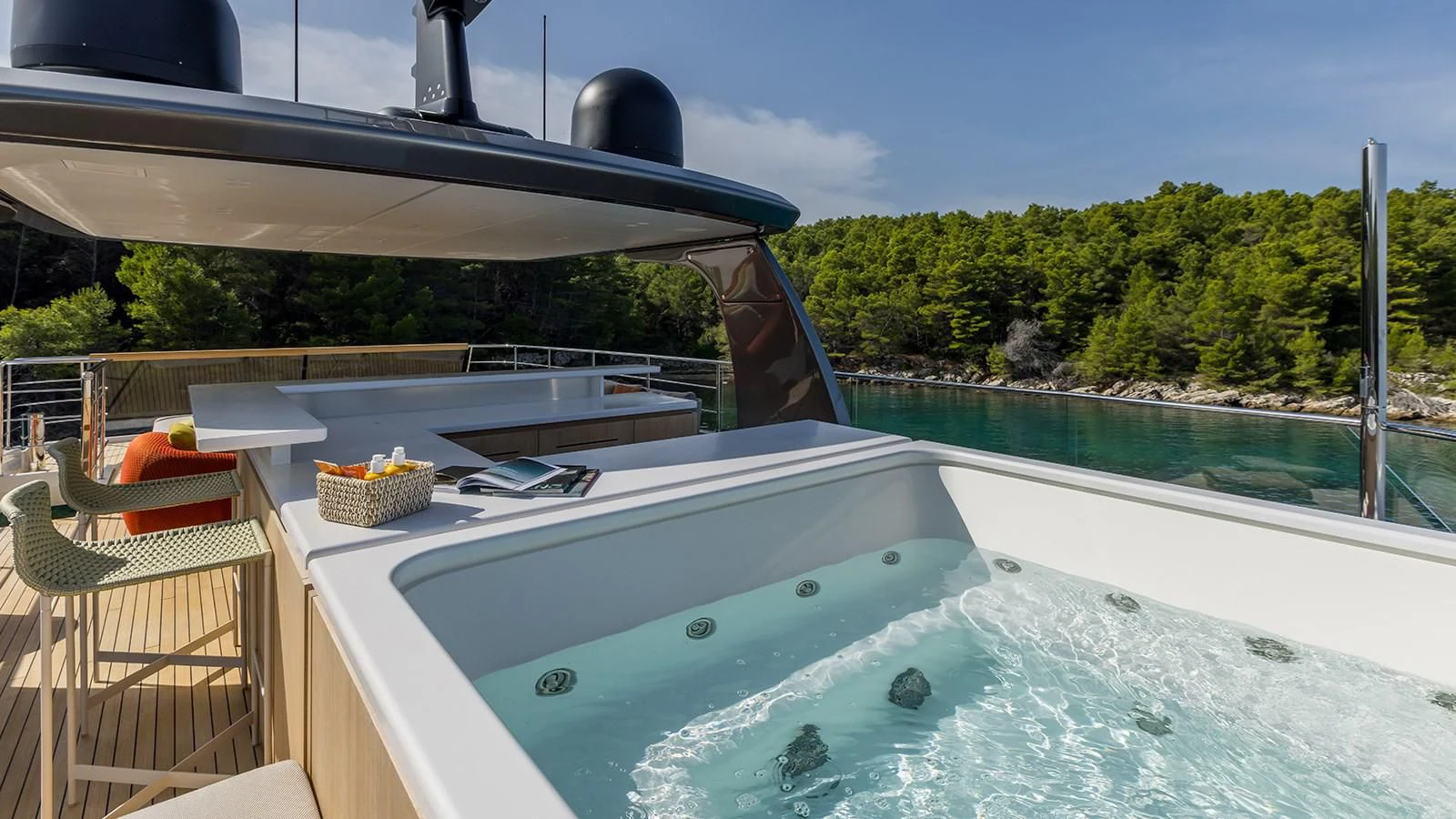 a pool with a deck and chairs aboard EROS Yacht for Sale