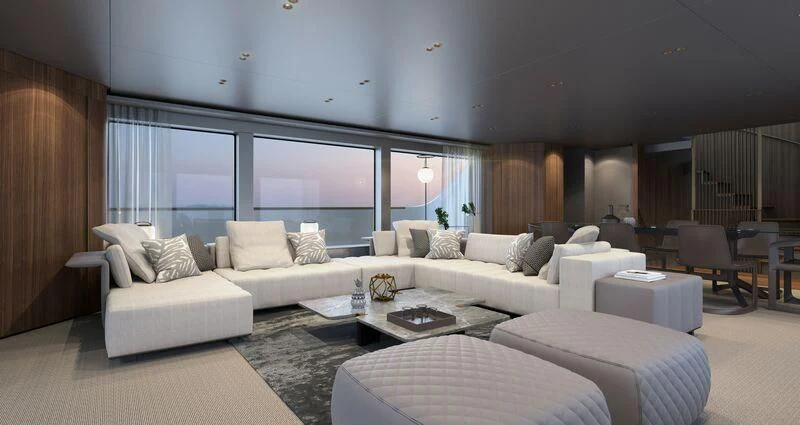 a living room with a large white couch and a large window aboard EROS Yacht for Sale