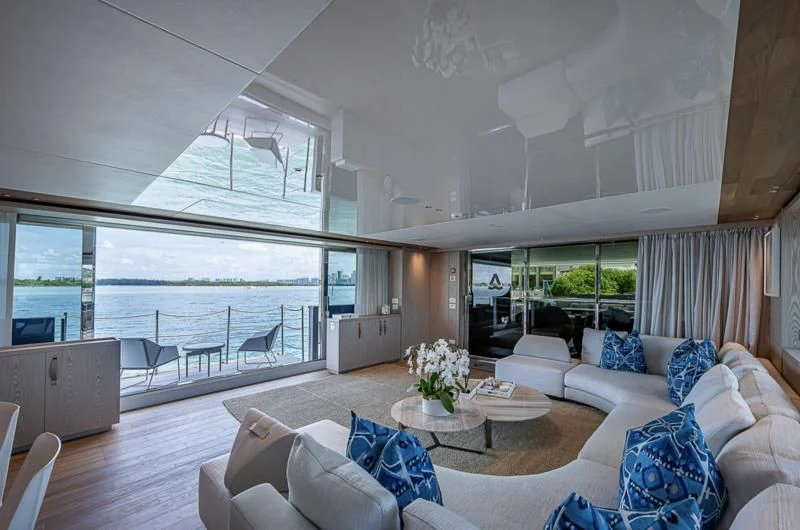 a living room with a large window aboard EROS Yacht for Sale