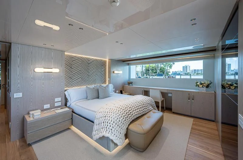 a bedroom with a large bed aboard EROS Yacht for Sale