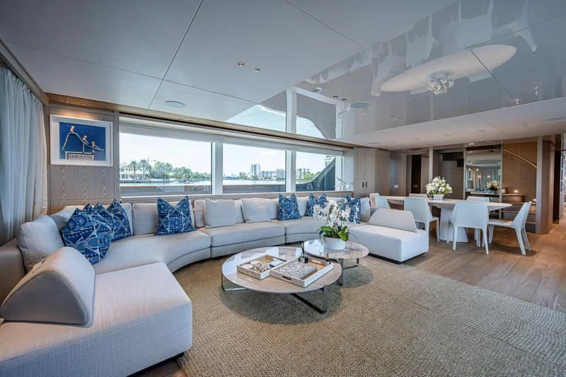 a living room with a couch and a table aboard EROS Yacht for Sale