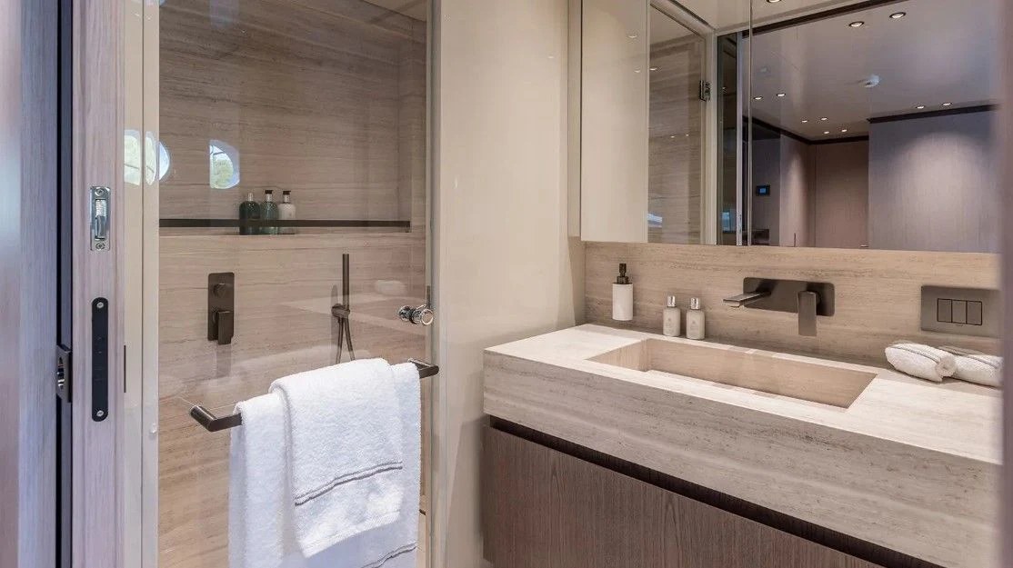 a bathroom with a large mirror aboard EROS Yacht for Sale