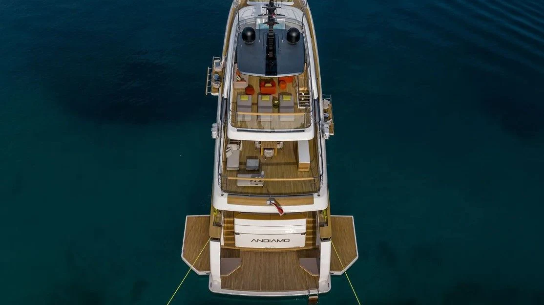 a yellow and white boat aboard EROS Yacht for Sale