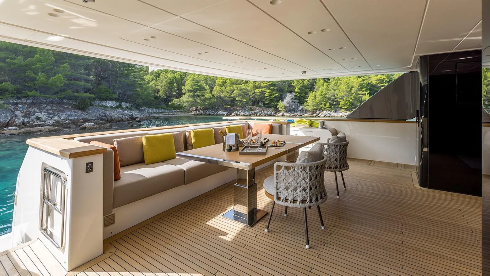 a living room with a couch and a table aboard EROS Yacht for Sale