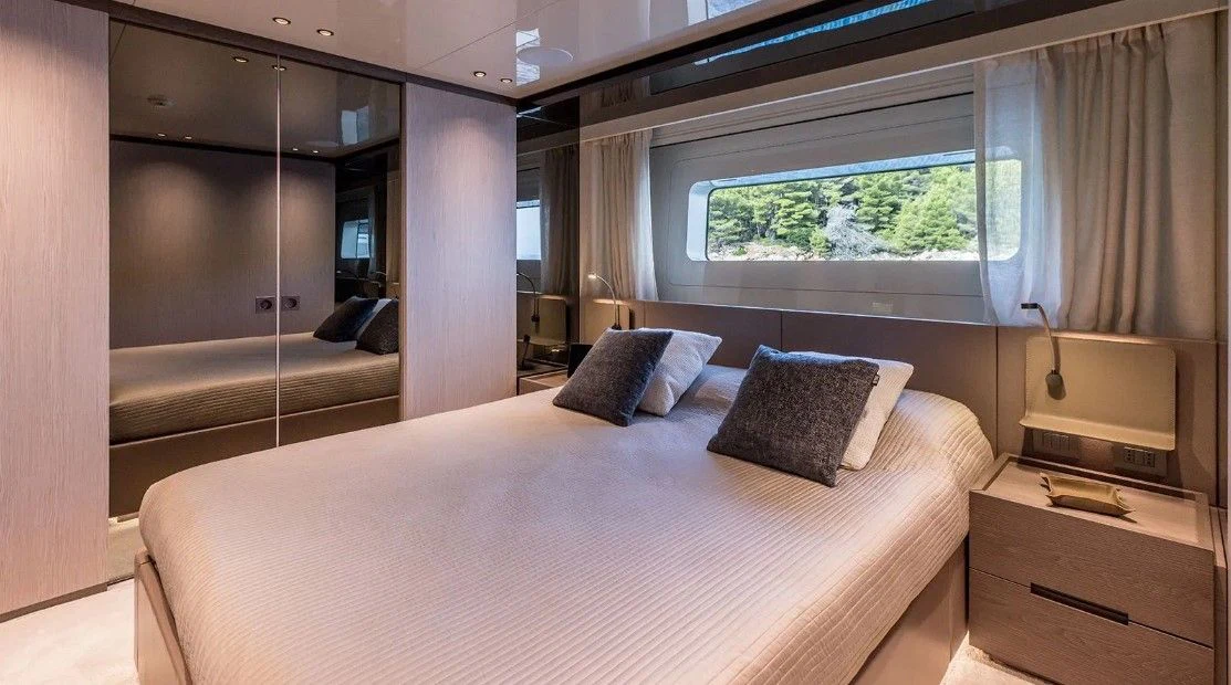 a bed in a room aboard EROS Yacht for Sale