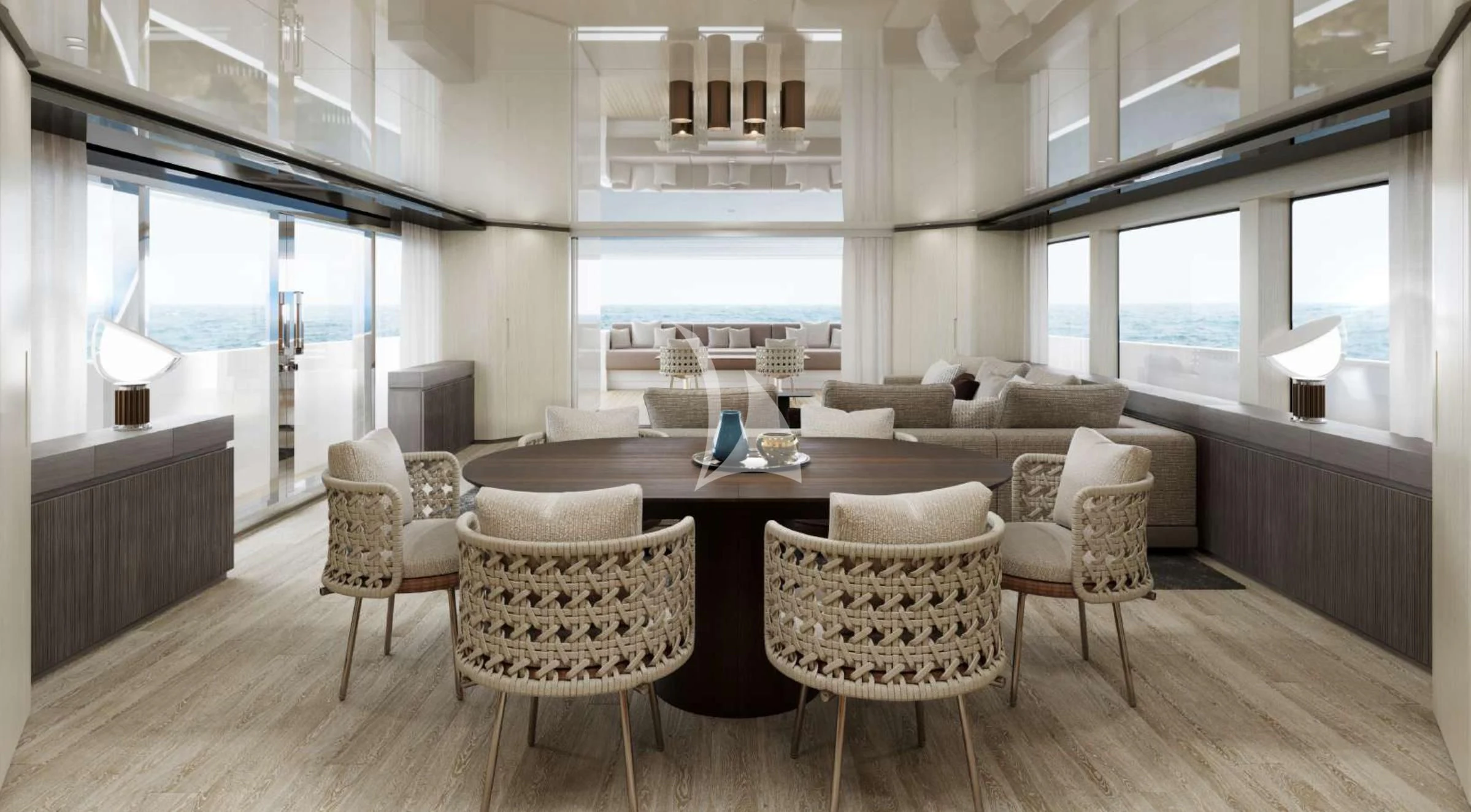 a room with a table chairs and a couch aboard EROS Yacht for Sale