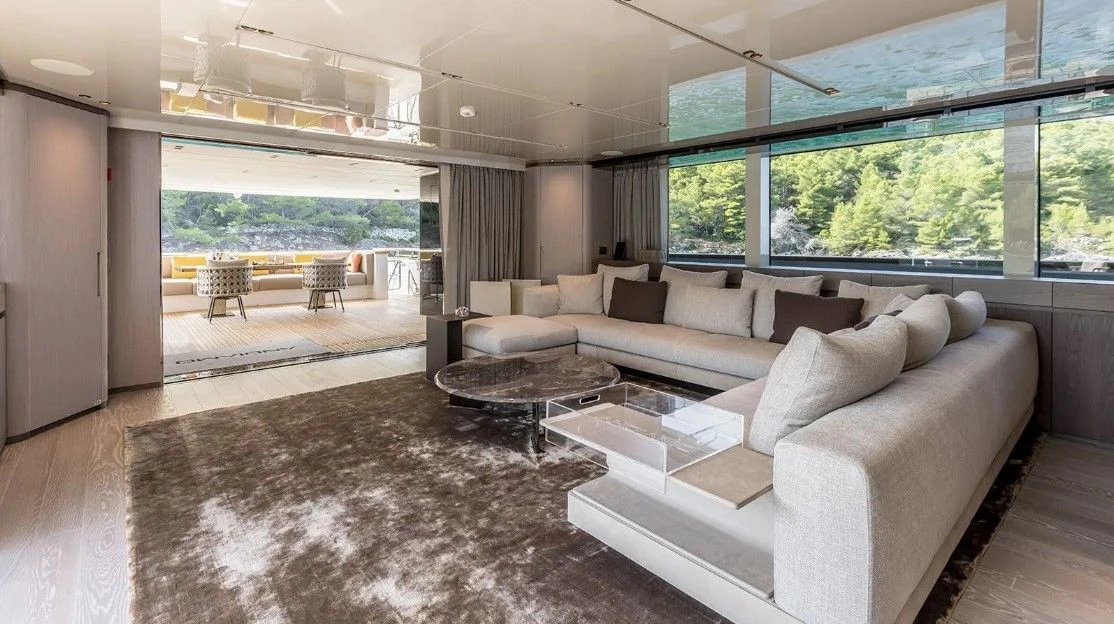 a living room with a large window aboard EROS Yacht for Sale