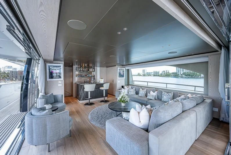 a living room with a large window aboard EROS Yacht for Sale