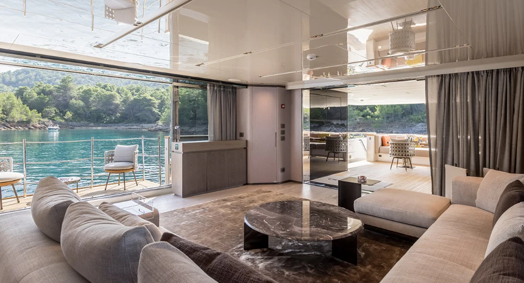 a living room with a large glass window aboard EROS Yacht for Sale