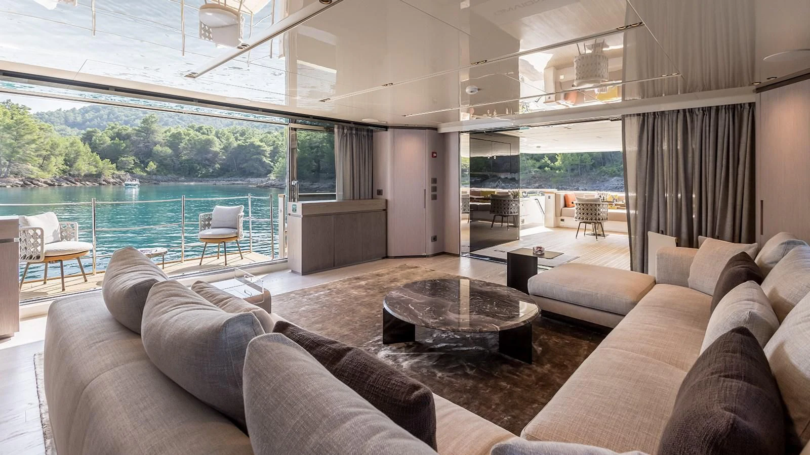 a living room with a large glass window aboard EROS Yacht for Sale