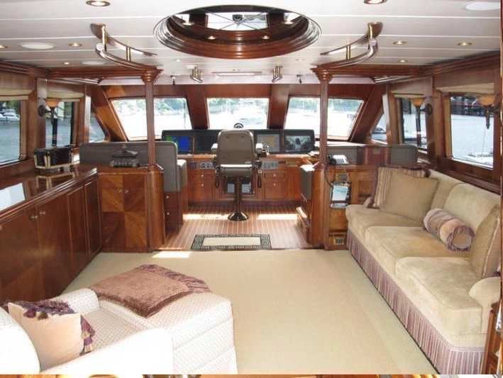 a room with a couch and a table aboard AUSTRALIS Yacht for Sale