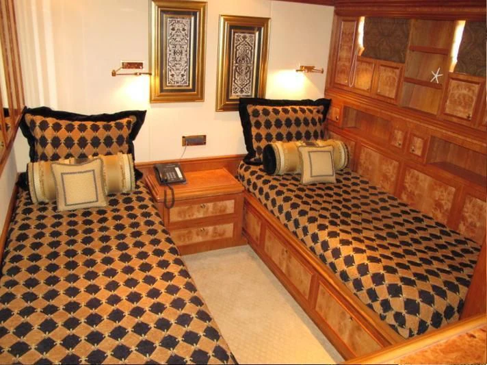 a couple of beds in a room aboard AUSTRALIS Yacht for Sale