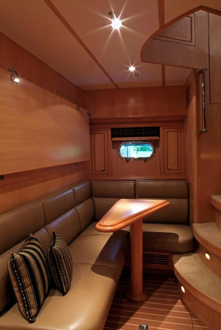 a living room with a fireplace aboard AUSTRALIS Yacht for Sale