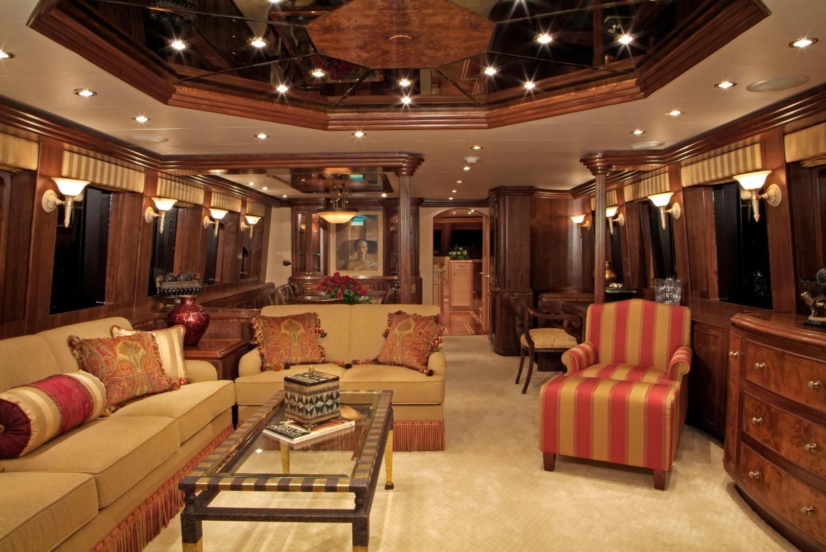 a living room with a couch and a table aboard AUSTRALIS Yacht for Sale