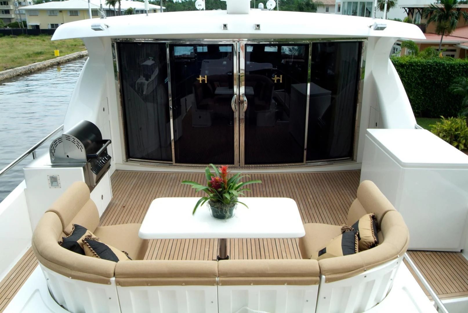 a boat with a table and chairs on the deck aboard AUSTRALIS Yacht for Sale