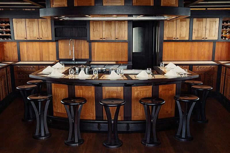 a kitchen with stools and stools aboard DUNIA BARU Yacht for Charter