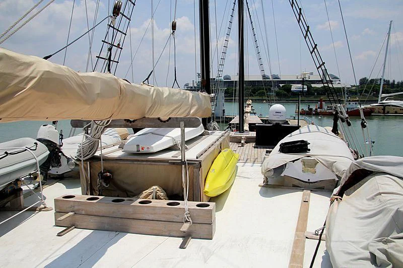 a boat is parked in a harbor aboard DUNIA BARU Yacht for Charter