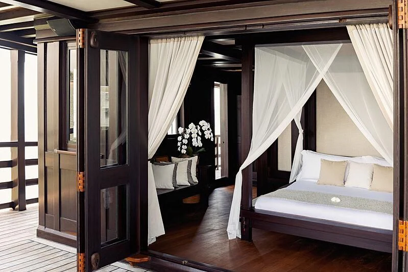 a bed in a room aboard DUNIA BARU Yacht for Charter