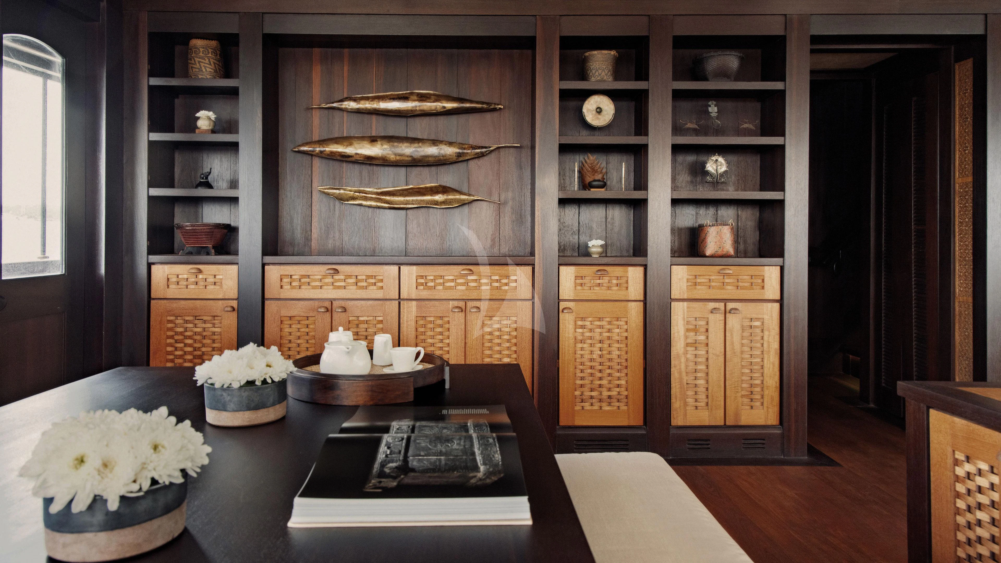 a kitchen with a table aboard DUNIA BARU Yacht for Charter