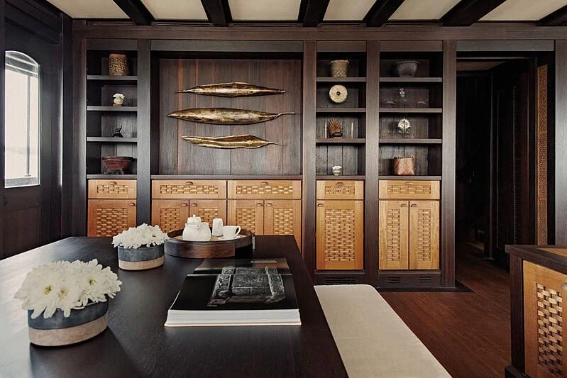 a kitchen with a table and shelves aboard DUNIA BARU Yacht for Charter