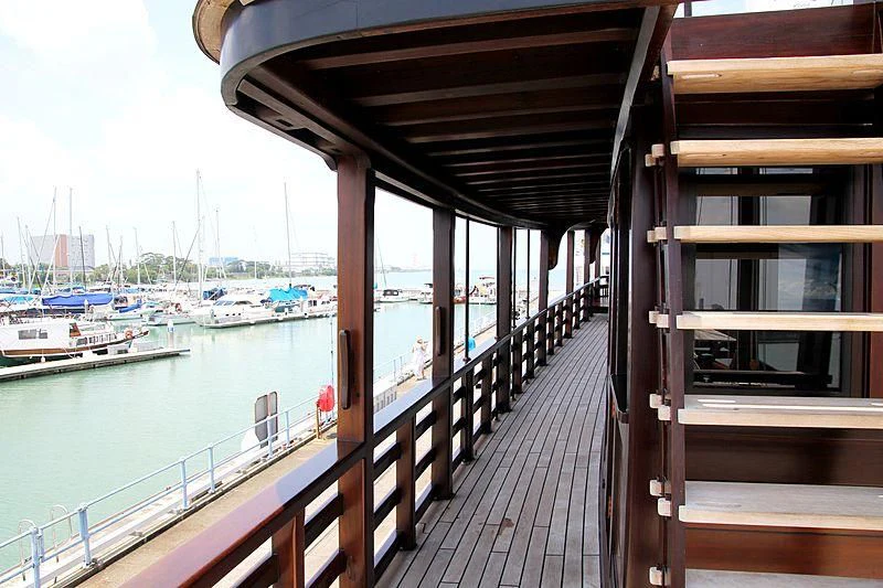 a wooden walkway over water aboard DUNIA BARU Yacht for Charter