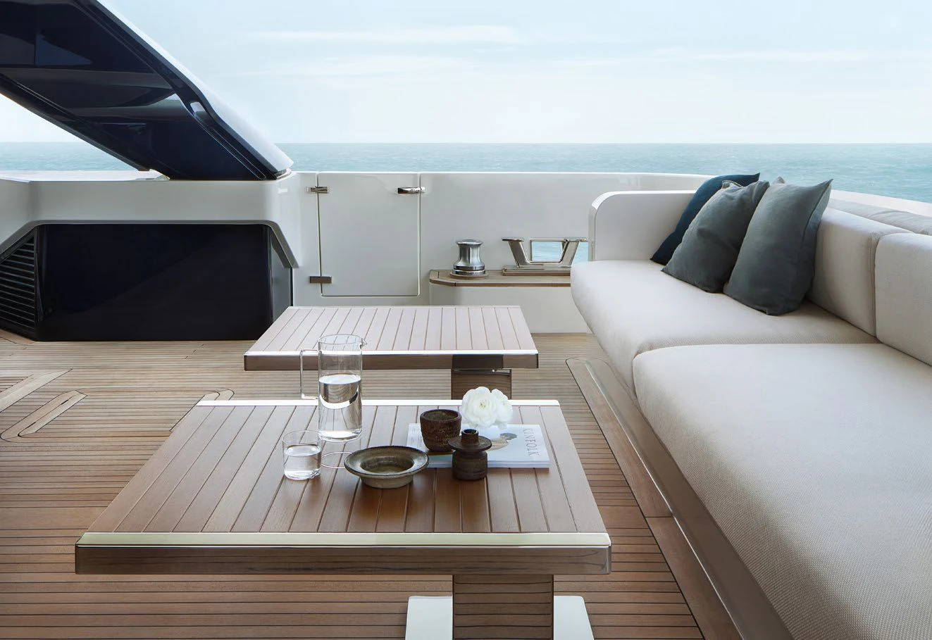 a living room with a couch and a table aboard STRA DODO Yacht for Sale