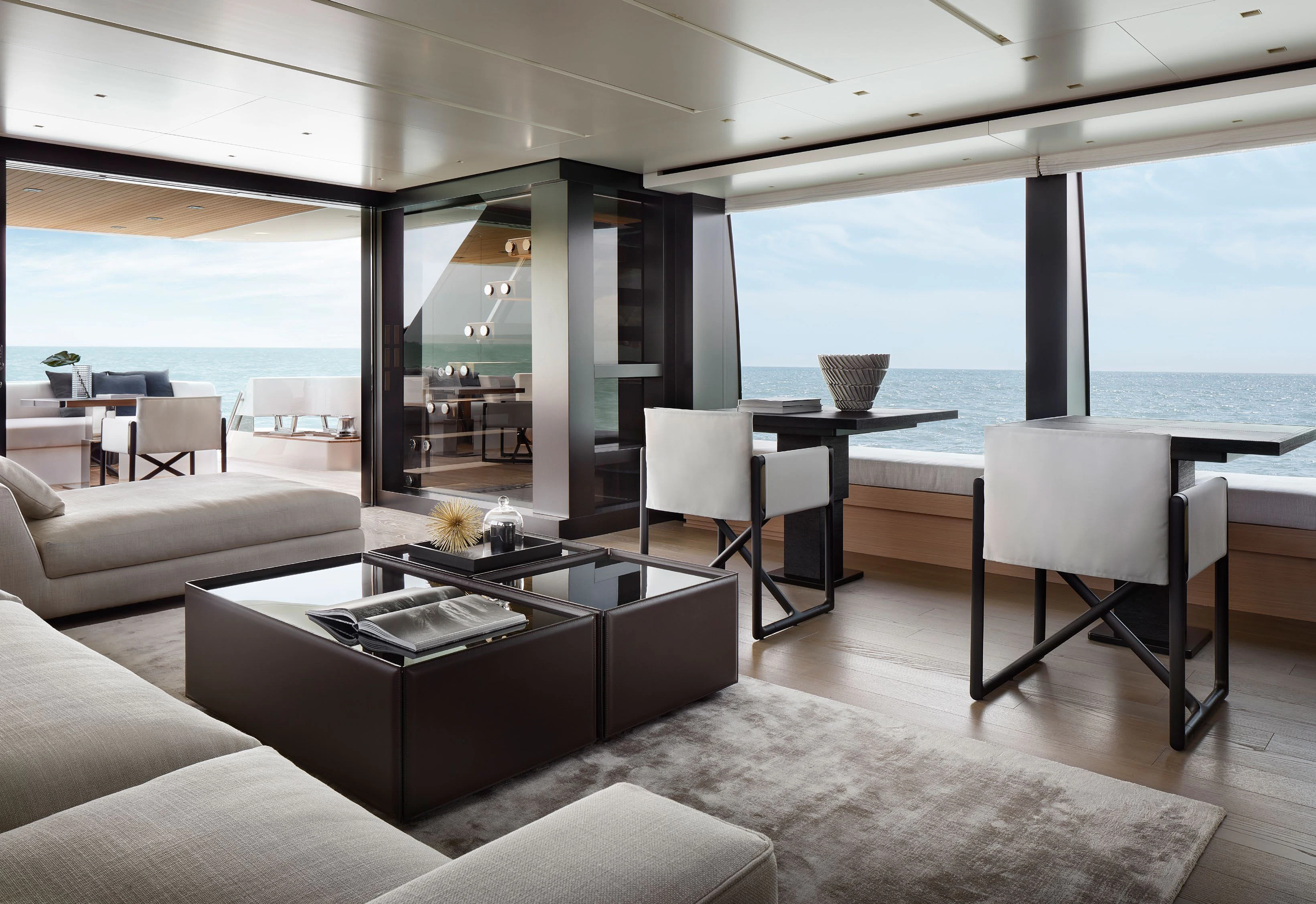 a room with a table and chairs aboard STRA DODO Yacht for Sale