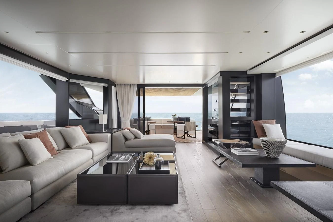 a living room with a large window aboard STRA DODO Yacht for Sale