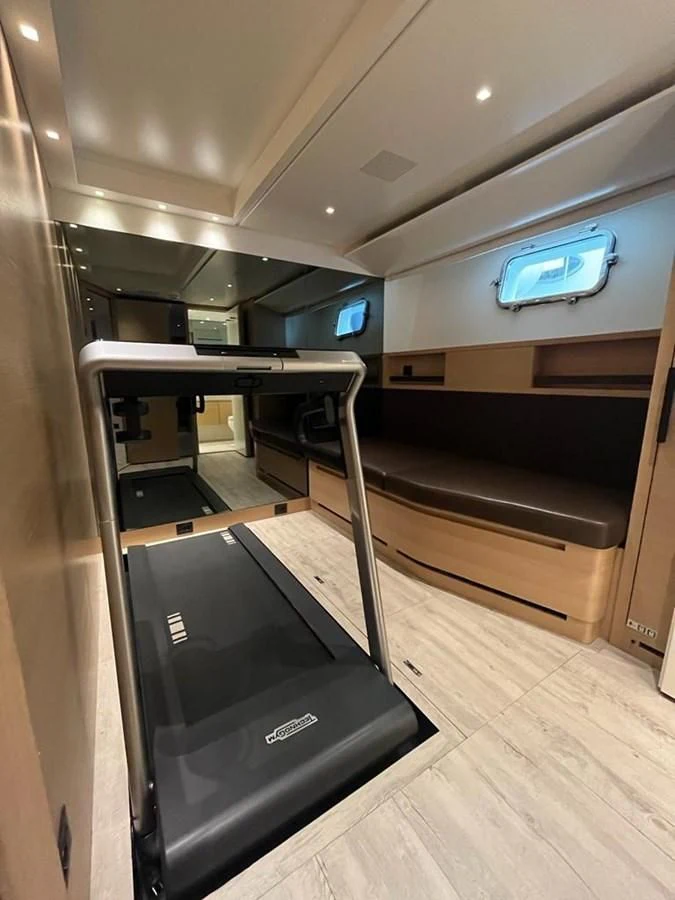 a black rectangular object with a black rectangular object on a wooden surface aboard STRA DODO Yacht for Sale